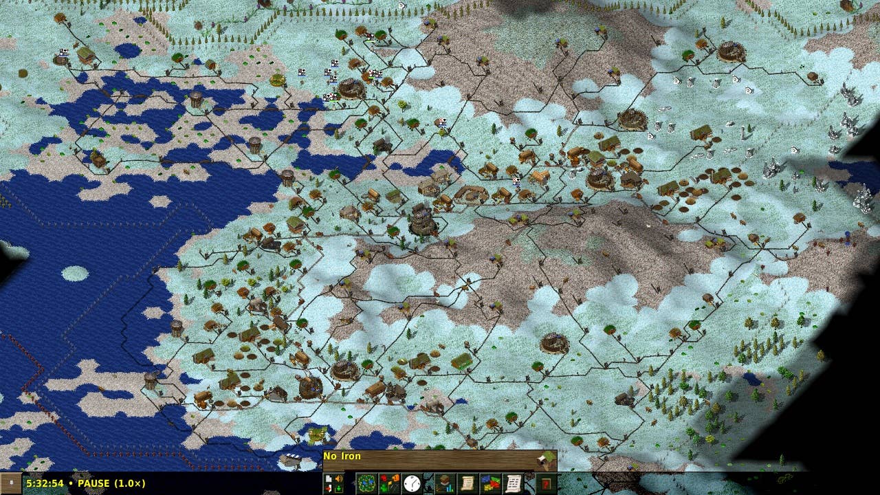 A panoramic view of a snow-covered landscape featuring an ocean and coastal settlements.