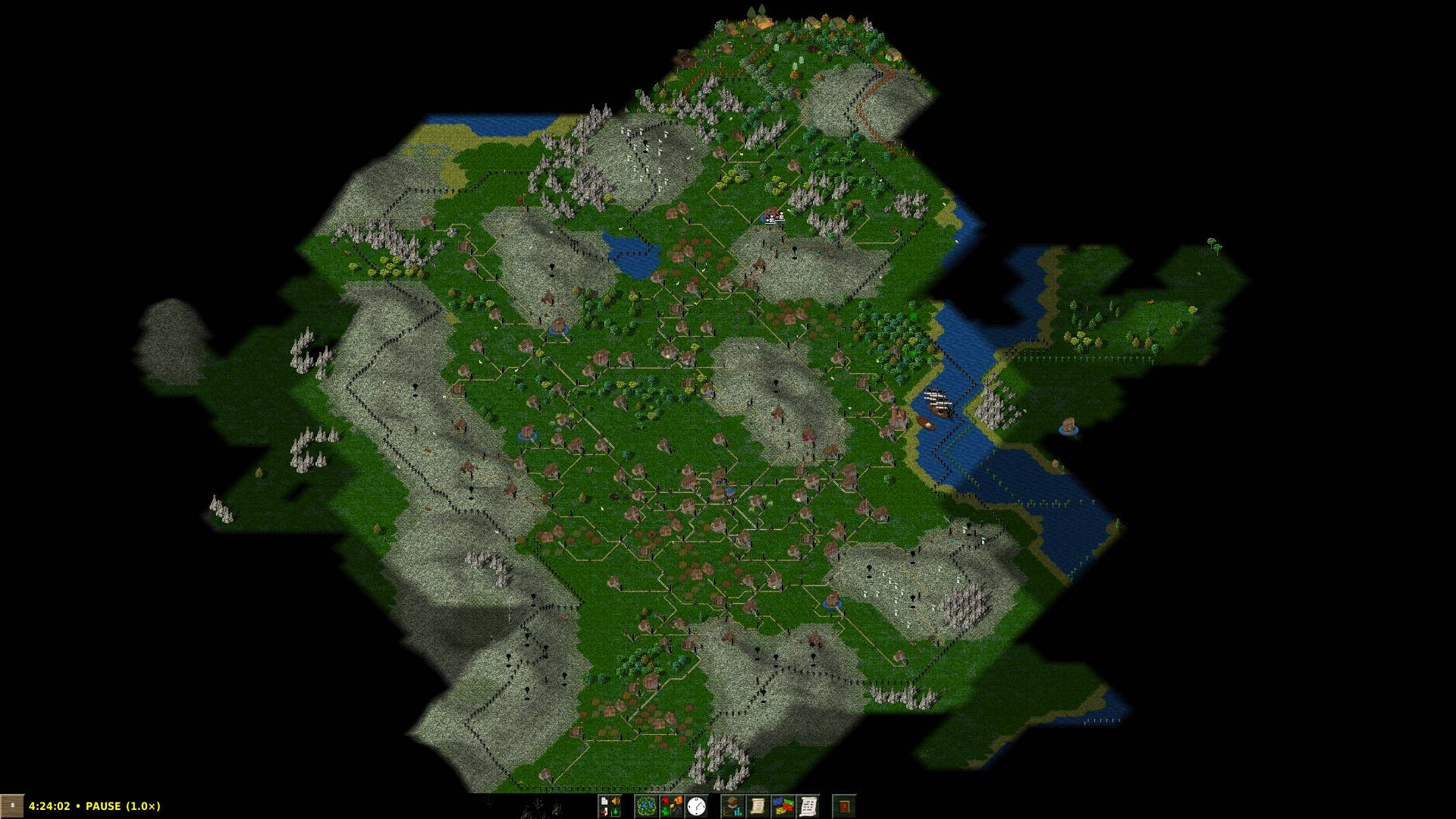 A broad view of a green land dotted with residential buildings and rolling hills.