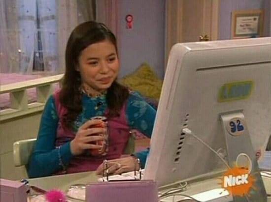 Miranda Cosgrove using a computer