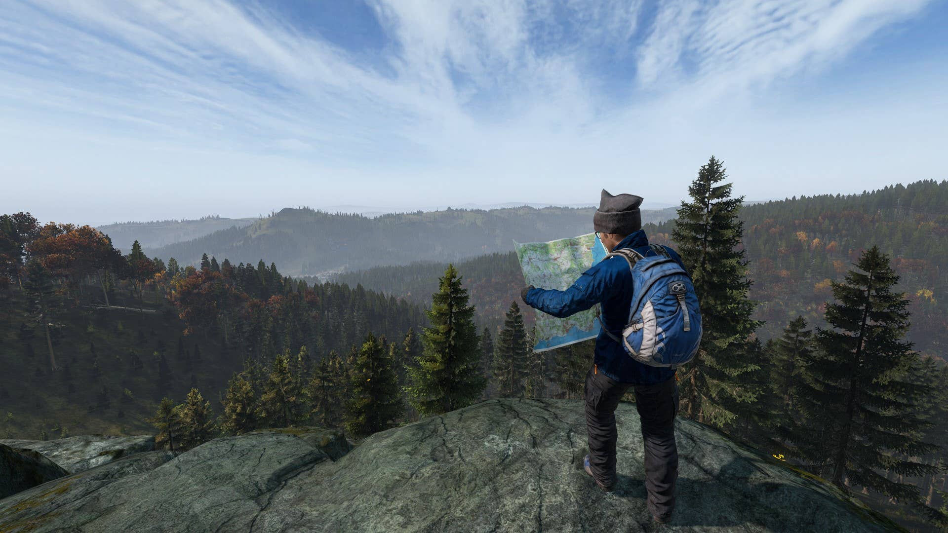 A survivor in DayZ consults his map while surveying Chernarus.
