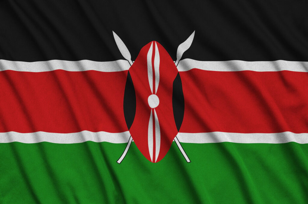 Kenya flag is depicted on a sports cloth fabric with many folds. Sport team waving banner