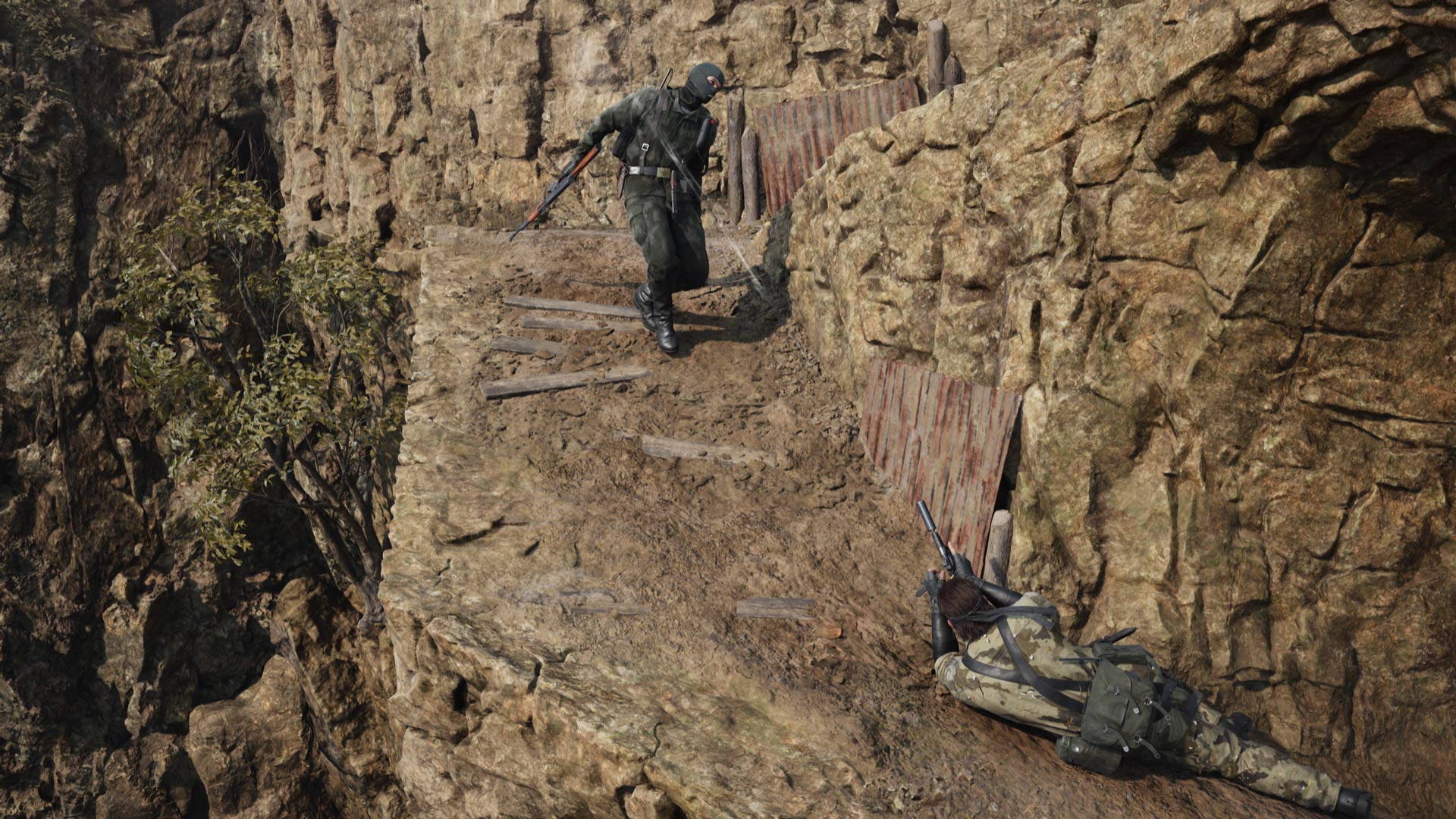 Snake crawls out of cover to fire at an enemy.