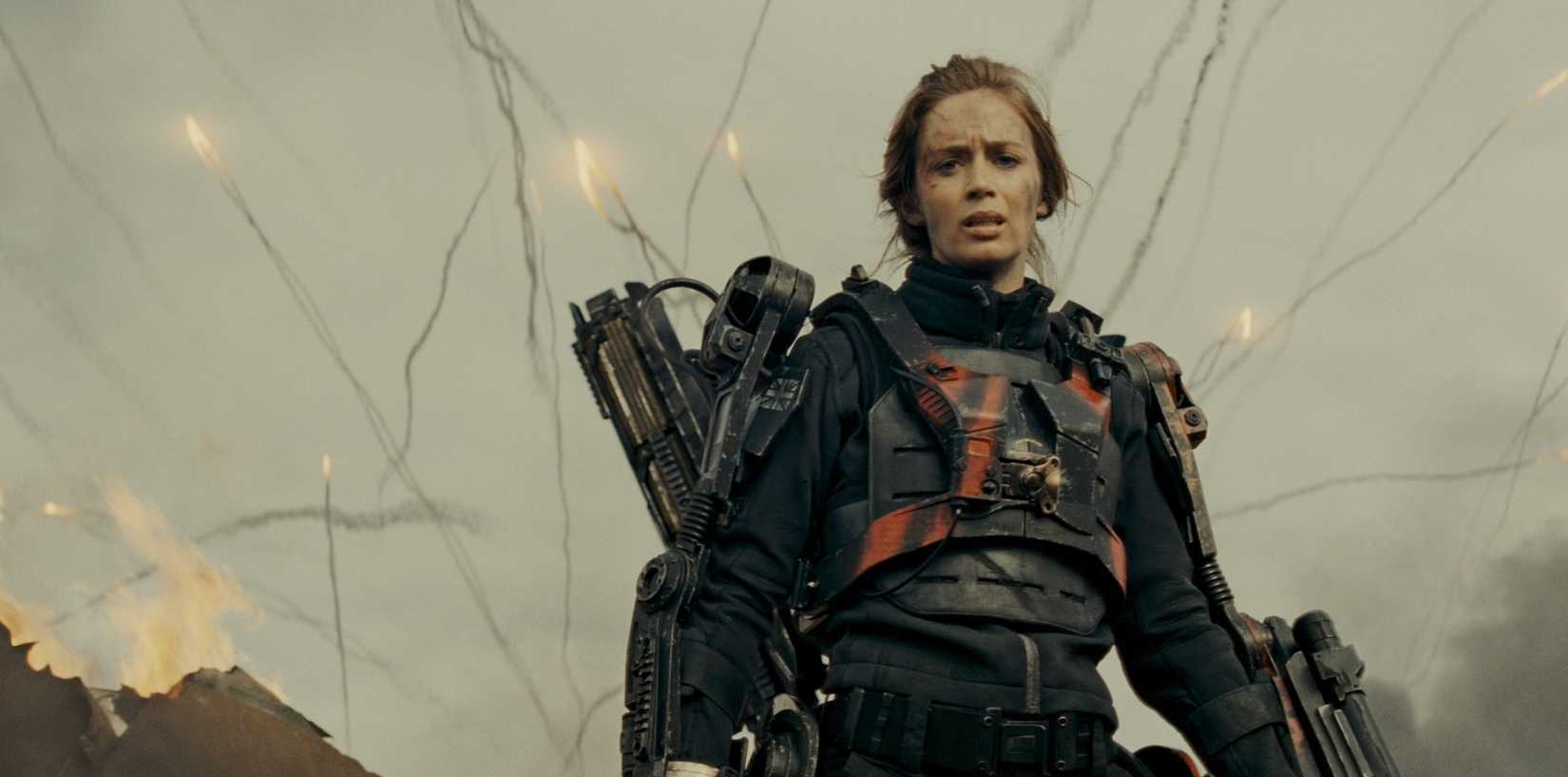 Emily Blunt in her war armor as missiles blast off behind her in Edge of Tomorrow
