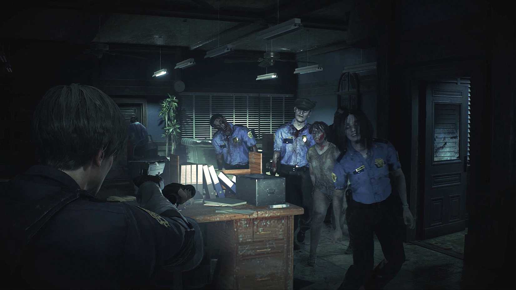 Leon encoutners a group of zombies in Resident Evil 2 (2019)